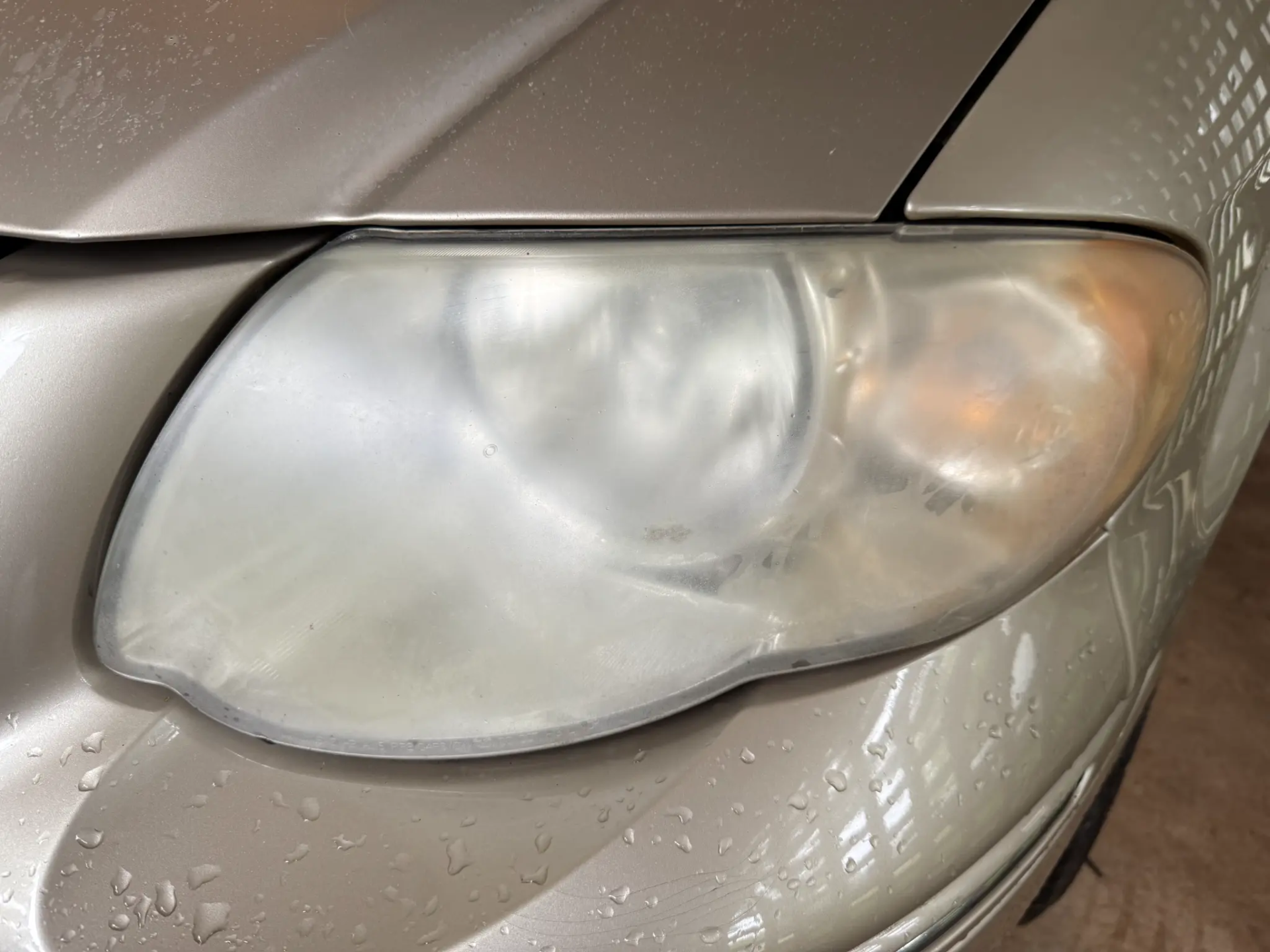 Cloudy yellowed headlight before restoration