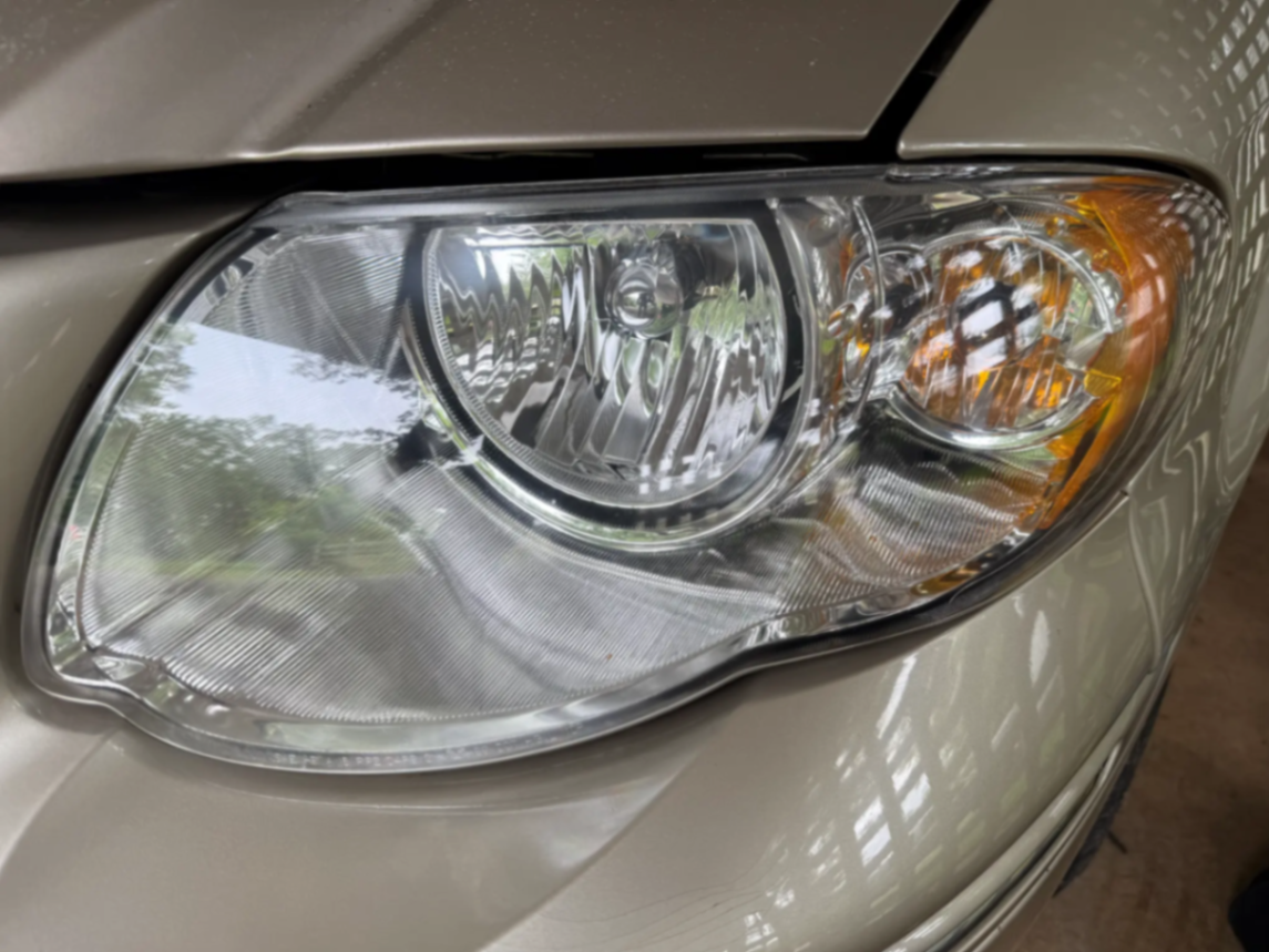 Crystal clear restored headlight after professional restoration